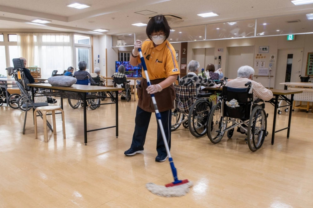 Michie Hino, 77, works at an elderly care home in Chiba Prefecture. She is one of a growing number of senior Japanese citizens working into their 70s. Michie Hino, 77, works at an elderly care home in Chiba Prefecture. She is one of a growing number of senior Japanese citizens working into their 70s.