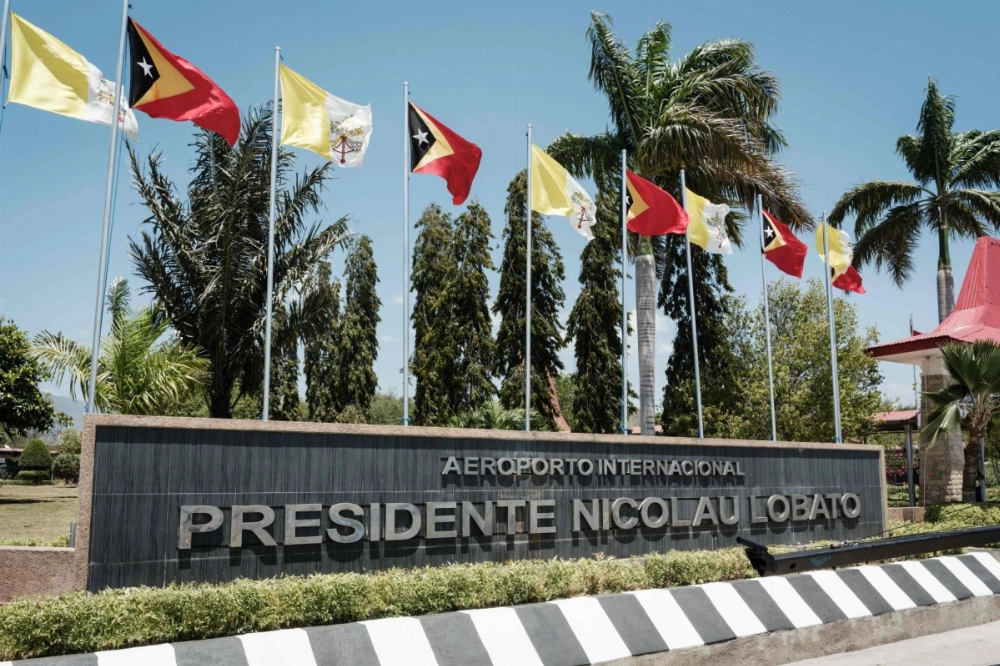 Flags of the Vatican and East Timor wave at the Presidente Nicolau Lobato International Airport ahead of Pope Francis' visit in Dili on Saturday. Flags of the Vatican and East Timor wave at the Presidente Nicolau Lobato International Airport ahead of Pope Francis' visit in Dili on Saturday.