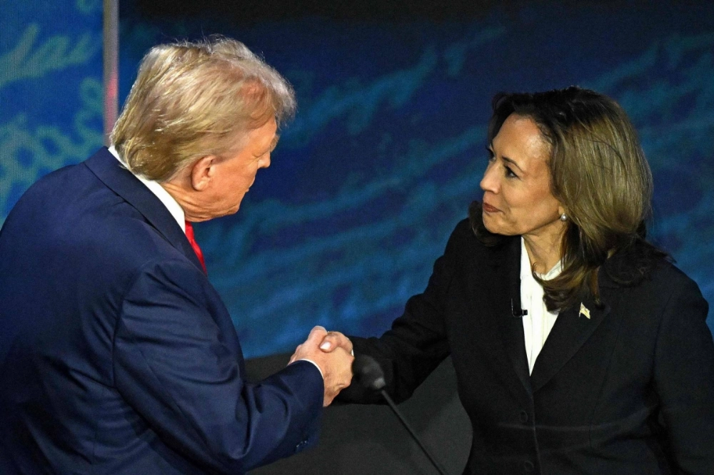 U.S. Vice President and Democratic presidential candidate Kamala Harris shakes hands with former U.S. President and Republican presidential candidate Donald Trump during a debate at the National Constitution Center in Philadelphia on Tuesday. U.S. Vice President and Democratic presidential candidate Kamala Harris shakes hands with former U.S. President and Republican presidential candidate Donald Trump during a debate at the National Constitution Center in Philadelphia on Tuesday.