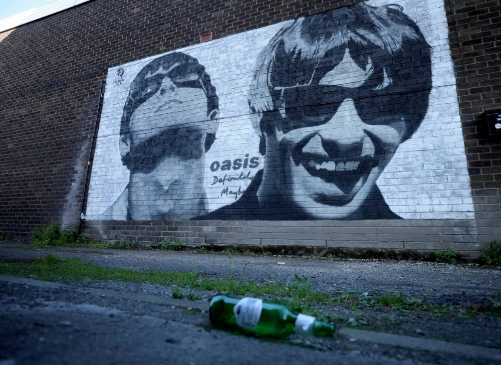 Oasis band members Liam and Noel Gallagher are the subjects of a mural by artist Pic.One.Art in the Burnage area of Manchester, England. Oasis band members Liam and Noel Gallagher are the subjects of a mural by artist Pic.One.Art in the Burnage area of Manchester, England.