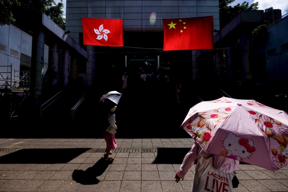 The flags of China (right) and the Hong Kong Special Administrative Region (HKSAR) in the Tsim Sha Tsui district in Hong Kong on June 23 The flags of China (right) and the Hong Kong Special Administrative Region (HKSAR) in the Tsim Sha Tsui district in Hong Kong on June 23