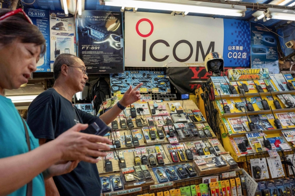 The logo of Japanese walkie-talkie maker Icom at a shop in Tokyo. The firm said that it had stopped producing the model of radios reportedly used in recent blasts in Lebanon around a decade ago. The logo of Japanese walkie-talkie maker Icom at a shop in Tokyo. The firm said that it had stopped producing the model of radios reportedly used in recent blasts in Lebanon around a decade ago.