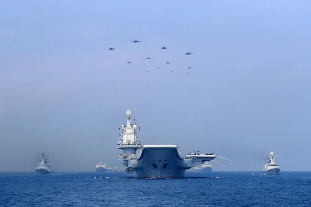 Warships and fighter jets of the Chinese People's Liberation Army Navy take part in a military display in the South China Sea in April 2018. Warships and fighter jets of the Chinese People's Liberation Army Navy take part in a military display in the South China Sea in April 2018.