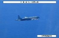 A Russian IL-38 patrol aircraft is seen in this image taken by the Air Self-Defense Force on Monday. | JAPANESE DEFENSE MINISTRY