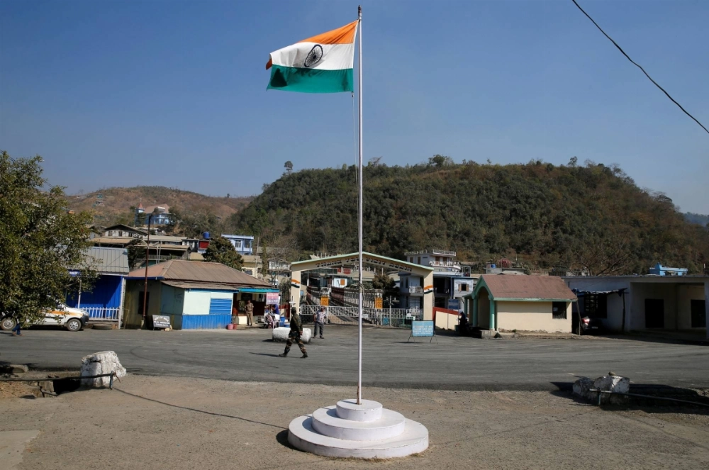 An Indian national flag flies next to an immigration check post on the India-Myanmar border in Zokhawthar village in the Champhai district of India's northeastern state of Mizoram, in 2021. An Indian national flag flies next to an immigration check post on the India-Myanmar border in Zokhawthar village in the Champhai district of India's northeastern state of Mizoram, in 2021.