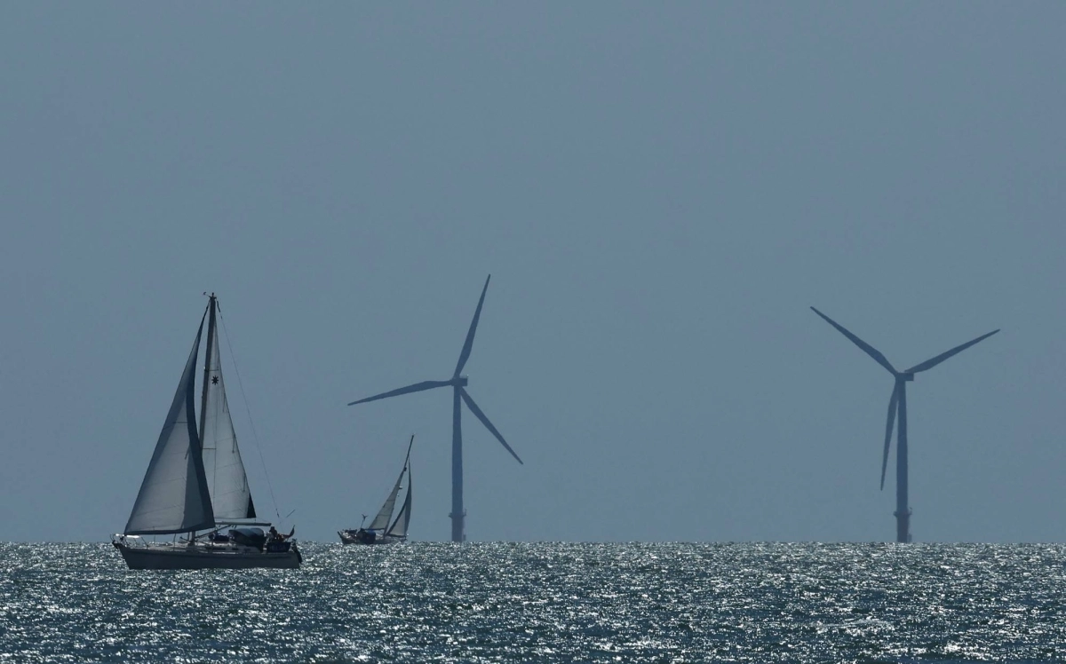 A yacht sails in front of an offshore wind farm, seen from Walton-on-the-Naze, southern Britain, on Aug. 13. A yacht sails in front of an offshore wind farm, seen from Walton-on-the-Naze, southern Britain, on Aug. 13.
