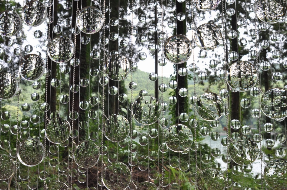 “A Whisper in the Eye of the Storm,” by Canadian artists Caitlind R. C. Brown and Wayne Garrett is an outdoor installation of around 14,000 recycled lenses of varied prescriptions.  “A Whisper in the Eye of the Storm,” by Canadian artists Caitlind R. C. Brown and Wayne Garrett is an outdoor installation of around 14,000 recycled lenses of varied prescriptions.