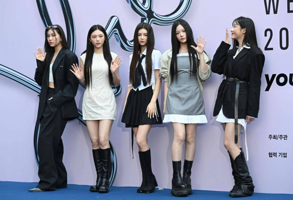 Members of the K-pop group NewJeans are embroiled in a dispute with their corporate backers over their creative relationship with an executive producer. Members of the K-pop group NewJeans are embroiled in a dispute with their corporate backers over their creative relationship with an executive producer.