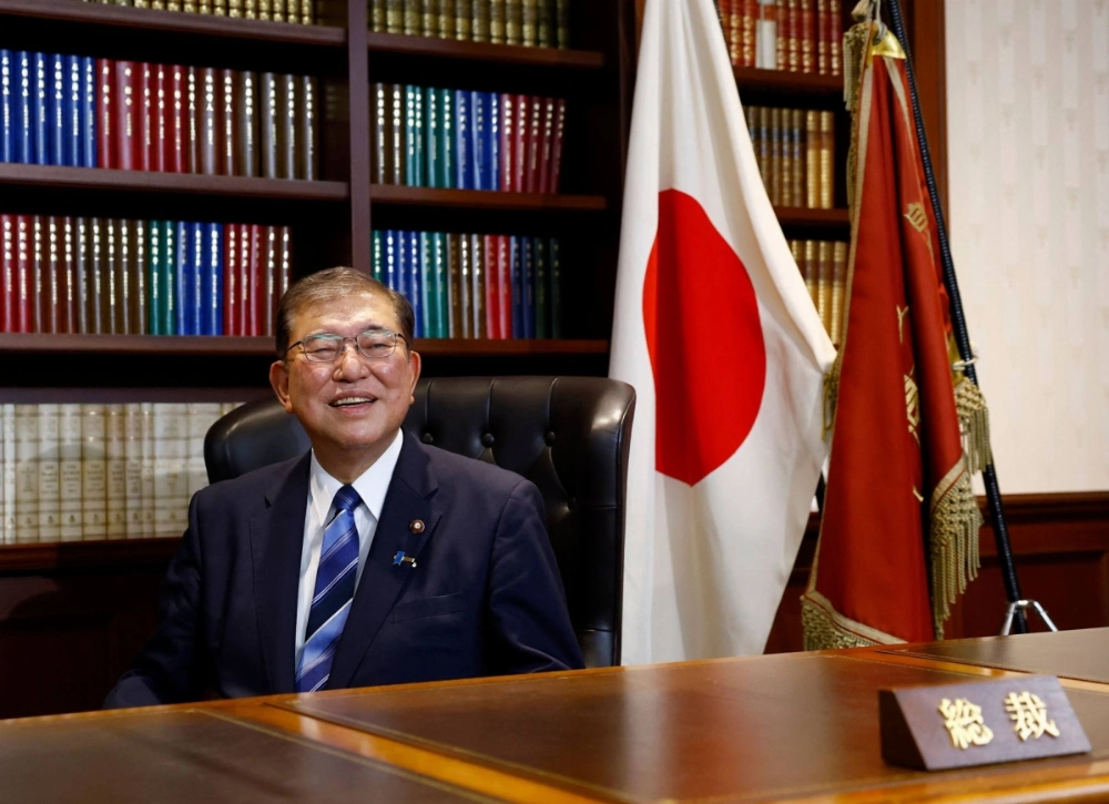 Former Defense Minister Shigeru Ishiba takes a seat in the Liberal Democratic Party president's office in Tokyo after being elected to the post on Friday.  Former Defense Minister Shigeru Ishiba takes a seat in the Liberal Democratic Party president's office in Tokyo after being elected to the post on Friday.