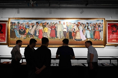 Visitors look at a painting of late Chinese Communist Party leader Mao Zedong at an exhibition held by Mao memorabilia collectors in Beijing on Sept. 21. Visitors look at a painting of late Chinese Communist Party leader Mao Zedong at an exhibition held by Mao memorabilia collectors in Beijing on Sept. 21.