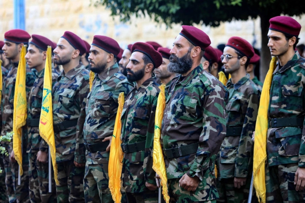 Hezbollah fighters take part in a funeral procession for one of the movement's commanders who was killed in an Israeli strike, in Beirut's southern suburbs on Wednesday. Hezbollah fighters take part in a funeral procession for one of the movement's commanders who was killed in an Israeli strike, in Beirut's southern suburbs on Wednesday.
