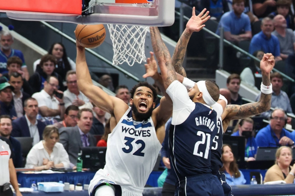 Timberwolves center Karl-Anthony Towns drives to the basket against Mavericks center Daniel Gafford during a playoff game in May.  Timberwolves center Karl-Anthony Towns drives to the basket against Mavericks center Daniel Gafford during a playoff game in May.