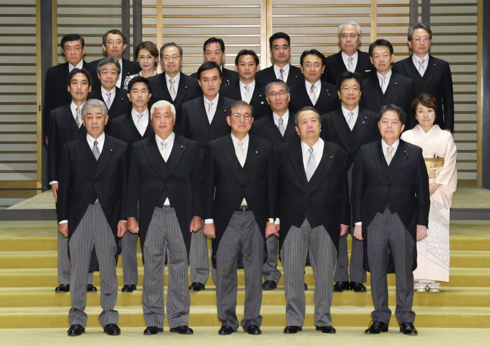 New Prime Minister Shigeru Ishiba (front center) and other Cabinet ministers pose for a commemorative photo after an appointment and certification ceremony at the Imperial Palace in Tokyo on Tuesday. New Prime Minister Shigeru Ishiba (front center) and other Cabinet ministers pose for a commemorative photo after an appointment and certification ceremony at the Imperial Palace in Tokyo on Tuesday.