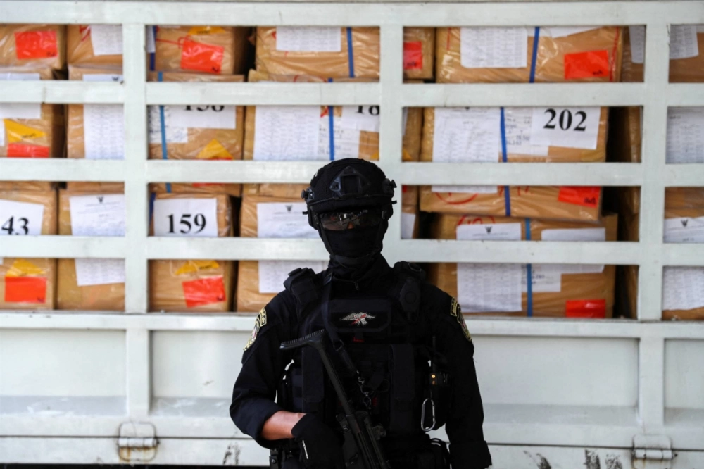 A police officer from the Narcotics Control Board stands guard in front of boxes of confiscated drugs during the 50th Destruction of Confiscated Narcotics ceremony in Ayutthaya province, Thailand, on June 26, 2020. A police officer from the Narcotics Control Board stands guard in front of boxes of confiscated drugs during the 50th Destruction of Confiscated Narcotics ceremony in Ayutthaya province, Thailand, on June 26, 2020.