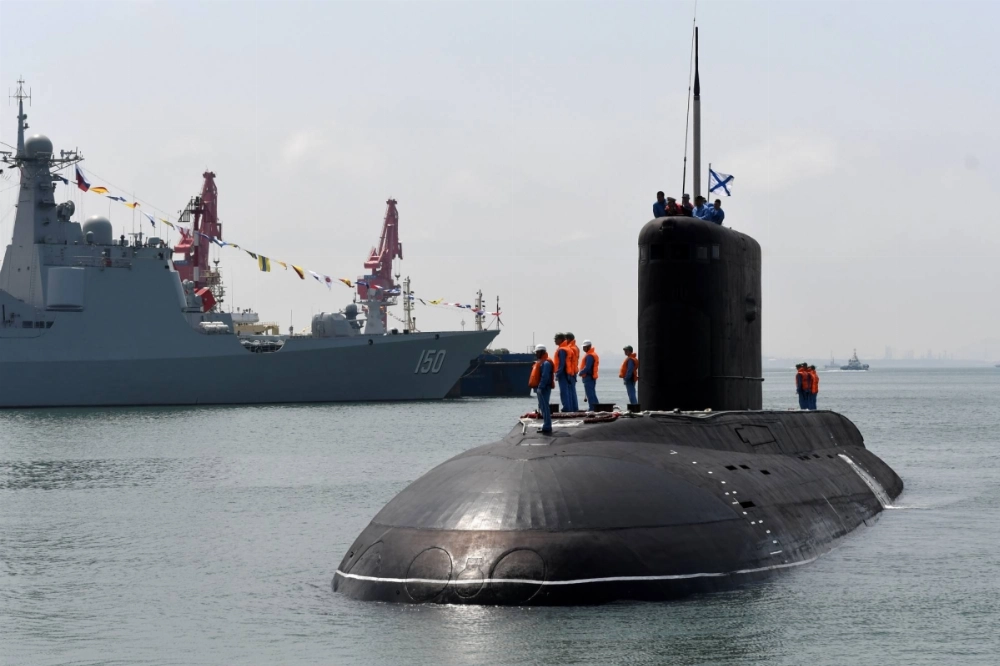 A Russian submarine arrives at the port of Dagang, in Qingdao, Shandong province, China, in April 2019 for a joint Chinese-Russian naval exercise.  A Russian submarine arrives at the port of Dagang, in Qingdao, Shandong province, China, in April 2019 for a joint Chinese-Russian naval exercise.