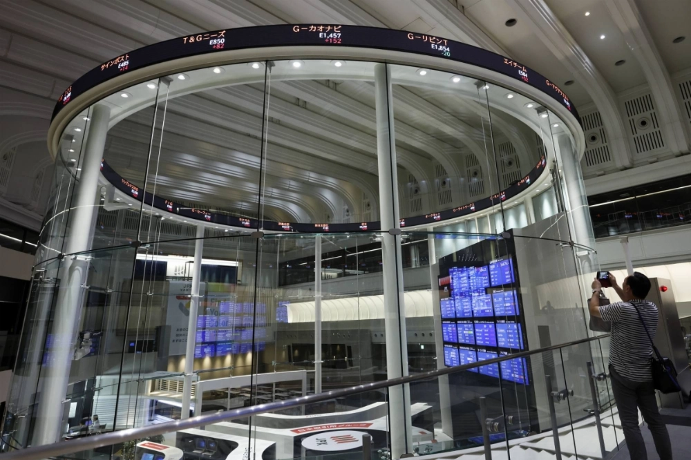 An electronic ticker at the Tokyo Stock Exchange An electronic ticker at the Tokyo Stock Exchange