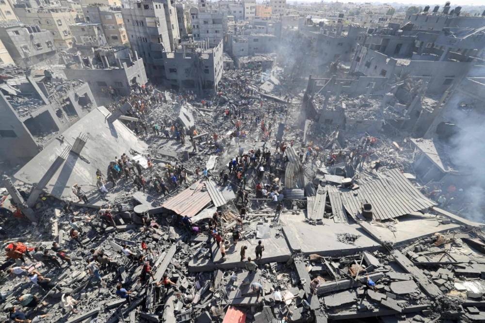 People search for survivors and the bodies of victims after an Israeli bombardment in the southern Gaza Strip on Oct. 26, 2023. People search for survivors and the bodies of victims after an Israeli bombardment in the southern Gaza Strip on Oct. 26, 2023.