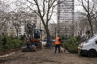Widening the sidewalk to make space for cycle lanes, footpaths and trees, in the Porte de La Chapelle neighborhood of Paris | Bloomberg