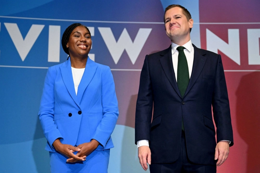 U.K. Conservative leadership candidates Kemi Badenoch (left) and Robert Jenrick after delivering speeches at the party's annual conference, in Birmingham, England, on Oct. 2.  U.K. Conservative leadership candidates Kemi Badenoch (left) and Robert Jenrick after delivering speeches at the party's annual conference, in Birmingham, England, on Oct. 2.