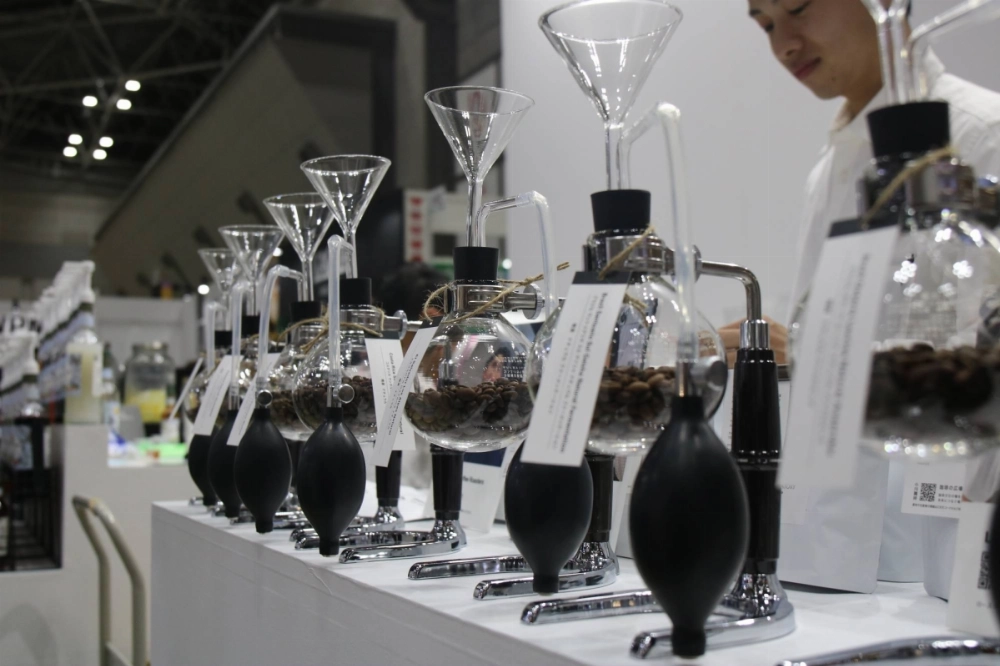 The Specialty Coffee Association of Japan's World Specialty Coffee Conference and Exhibition runs through Oct. 12 at Tokyo's Big Sight convention center, where Ogawa Coffee Laboratory is one of many companies showing off advances in coffee roasting and brewing. The Specialty Coffee Association of Japan's World Specialty Coffee Conference and Exhibition runs through Oct. 12 at Tokyo's Big Sight convention center, where Ogawa Coffee Laboratory is one of many companies showing off advances in coffee roasting and brewing.