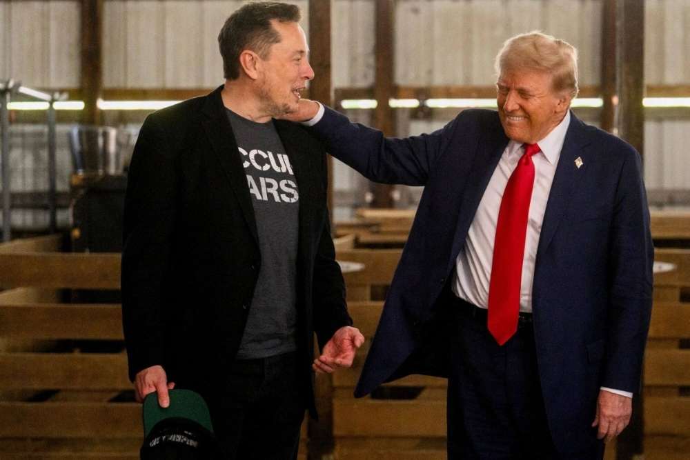 X owner Elon Musk and Republican presidential nominee and former U.S. President Donald Trump meet prior to a campaign event in Butler, Pennsylvania, on Oct. 5. X owner Elon Musk and Republican presidential nominee and former U.S. President Donald Trump meet prior to a campaign event in Butler, Pennsylvania, on Oct. 5.