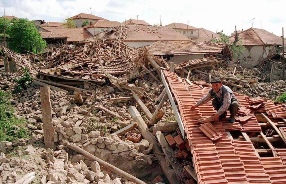 A man searches through the rubble of a wrecked house in the Turkish town of Cankiri after a strong earthquake hit central Turkey in June 2000. 
  A man searches through the rubble of a wrecked house in the Turkish town of Cankiri after a strong earthquake hit central Turkey in June 2000.