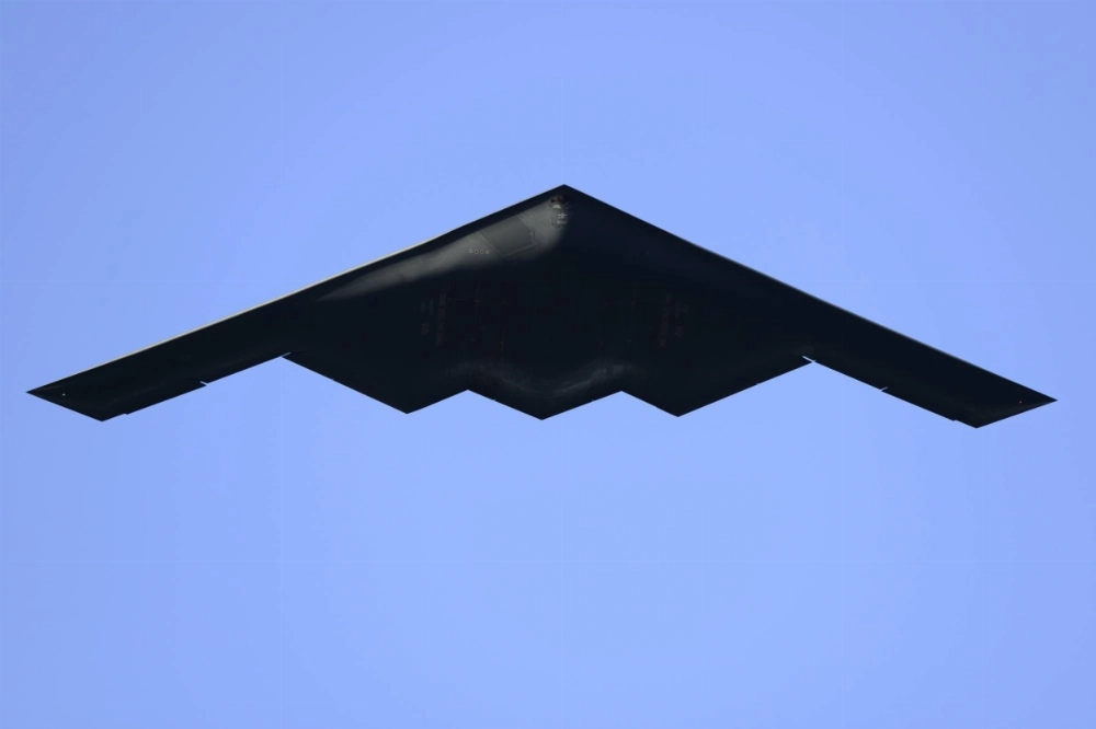 A B-2 Spirit Stealth Bomber flies over the 133rd Rose Parade in Pasadena, California, in 2022.  A B-2 Spirit Stealth Bomber flies over the 133rd Rose Parade in Pasadena, California, in 2022.