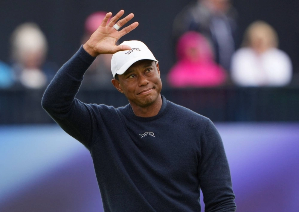 Tiger Woods acknowledges the crowd at the 18th green during the 152nd Open Championship at the Royal Troon Golf Club in Troon, Scotland, on July 19. Tiger Woods acknowledges the crowd at the 18th green during the 152nd Open Championship at the Royal Troon Golf Club in Troon, Scotland, on July 19.