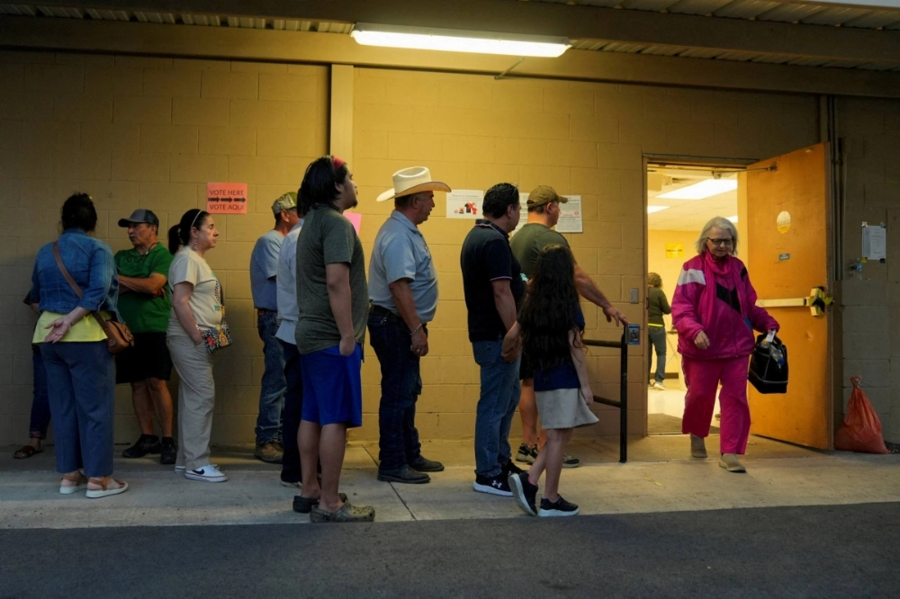People wait in a line to vote during the Super Tuesday primary election in Edinburg, Texas, on March 5. People wait in a line to vote during the Super Tuesday primary election in Edinburg, Texas, on March 5.