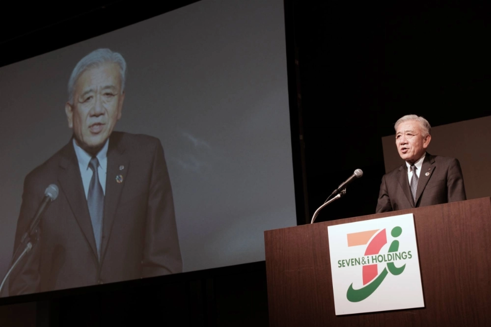 Ryuichi Isaka, CEO of Seven & I Holdings, speaks during a news conference in Tokyo in April. Isaka is now assuring investors that the group's revenue will likely almost double by the 2030 fiscal year. Ryuichi Isaka, CEO of Seven & I Holdings, speaks during a news conference in Tokyo in April. Isaka is now assuring investors that the group's revenue will likely almost double by the 2030 fiscal year.