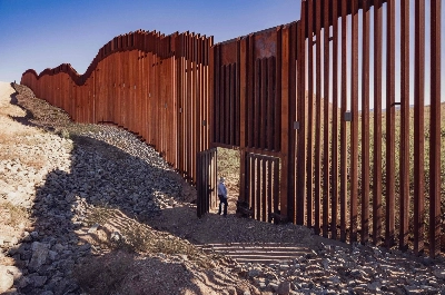 A rancher stands near a door of the wall built under Donald Trump's presidency. A poll completed this week showed that 65% of registered voters believe the U.S. is on the wrong track on immigration policy, with voters favoring Trump's approach. A rancher stands near a door of the wall built under Donald Trump's presidency. A poll completed this week showed that 65% of registered voters believe the U.S. is on the wrong track on immigration policy, with voters favoring Trump's approach.