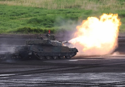 A Japan Ground Self-Defense Force battle tank fires ammunition during a live fire exercise at East Fuji Maneuver Area in Gotemba, Shizuoka Prefecture, in May. A Japan Ground Self-Defense Force battle tank fires ammunition during a live fire exercise at East Fuji Maneuver Area in Gotemba, Shizuoka Prefecture, in May.