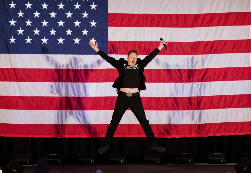 Tesla and SpaceX CEO Elon Musk jumps on stage as he arrives to speak at a town hall event hosted by America PAC in support of former U.S. President and Republican presidential candidate Donald Trump at the Greater Philadelphia Expo Center in Oaks, Pennsylvania, on Oct. 18. Tesla and SpaceX CEO Elon Musk jumps on stage as he arrives to speak at a town hall event hosted by America PAC in support of former U.S. President and Republican presidential candidate Donald Trump at the Greater Philadelphia Expo Center in Oaks, Pennsylvania, on Oct. 18.