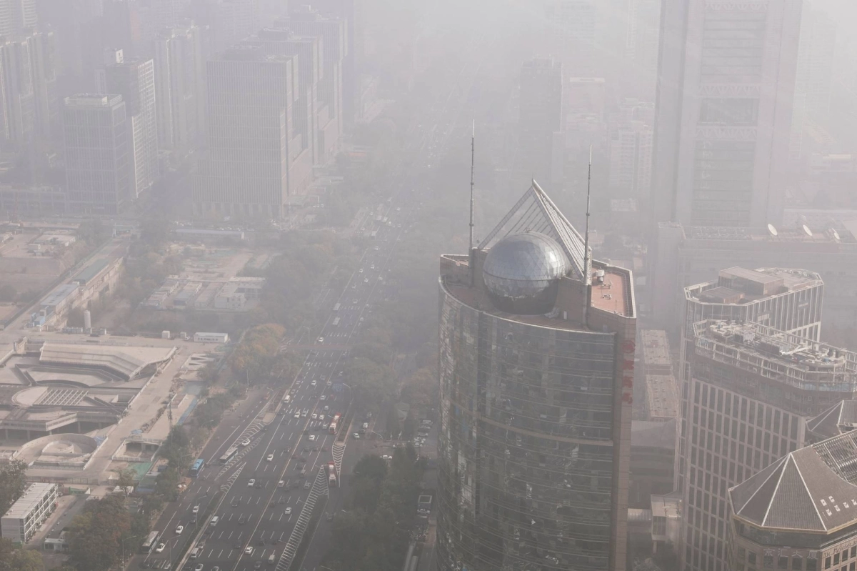 Cars move on a street in Beijing as the city is shrouded in smog. China still owed €5.6 million to the core budget, though it has contributed €497,000 to the supplementary fund. Cars move on a street in Beijing as the city is shrouded in smog. China still owed €5.6 million to the core budget, though it has contributed €497,000 to the supplementary fund.