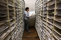 Amalia Diaz, director of herbarium and seed collection of the Alexander von Humboldt Biological Resources Research Institute, holds a symplocaceae plant.  | REUTERS