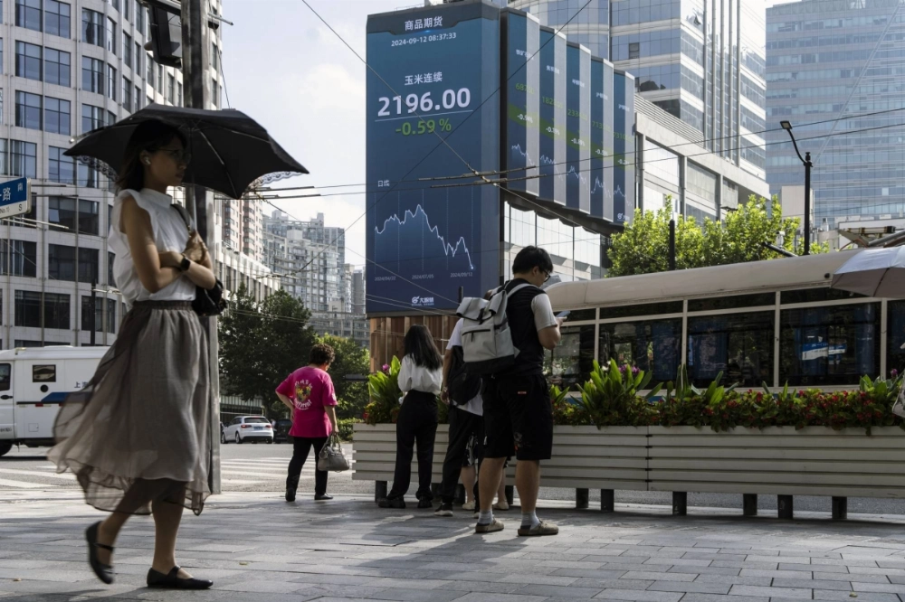 A public screen displays financial figures in Shanghai on Sept. 12. A public screen displays financial figures in Shanghai on Sept. 12.