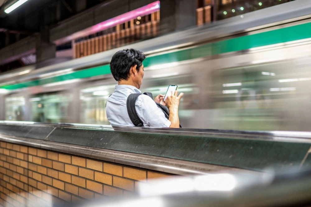 A man waits for a train at Ebisu Station in Tokyo on Oct. 4. A man waits for a train at Ebisu Station in Tokyo on Oct. 4.