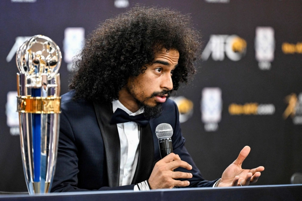 Qatar forward Akram Afif speaks during a news conference after being named the Asian Football Confederation's Player of the Year in Seoul on Tuesday.  Qatar forward Akram Afif speaks during a news conference after being named the Asian Football Confederation's Player of the Year in Seoul on Tuesday.