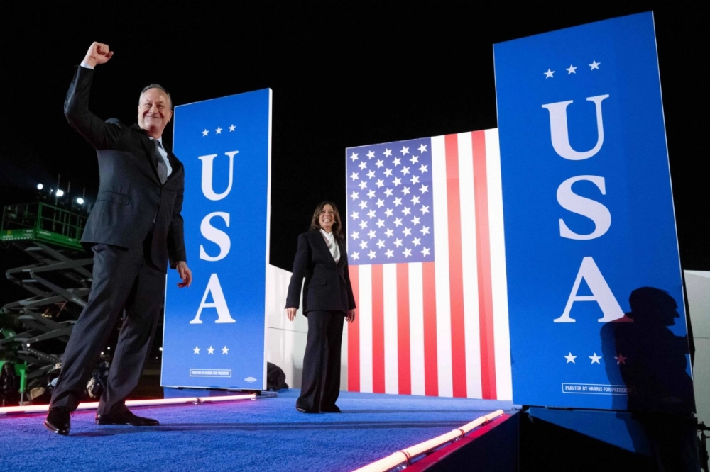 Democratic presidential nominee and U.S. Vice President Kamala Harris along with Second Gentleman Doug Emhoff attend a rally on the National Mall in Washington one week before the Nov. 5 national election. Democratic presidential nominee and U.S. Vice President Kamala Harris along with Second Gentleman Doug Emhoff attend a rally on the National Mall in Washington one week before the Nov. 5 national election.