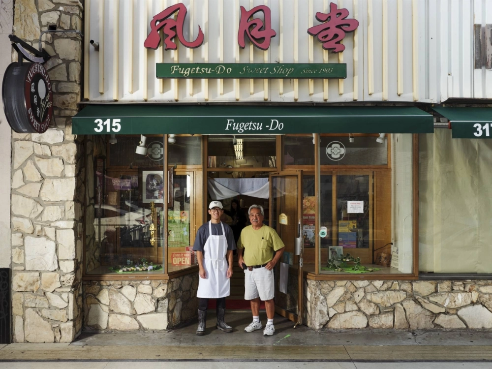 Korey Kito, left, stands with his father Brian Kito in front of their confectionery, Fugetsu-Do, in Los Angeles. Korey Kito, left, stands with his father Brian Kito in front of their confectionery, Fugetsu-Do, in Los Angeles.