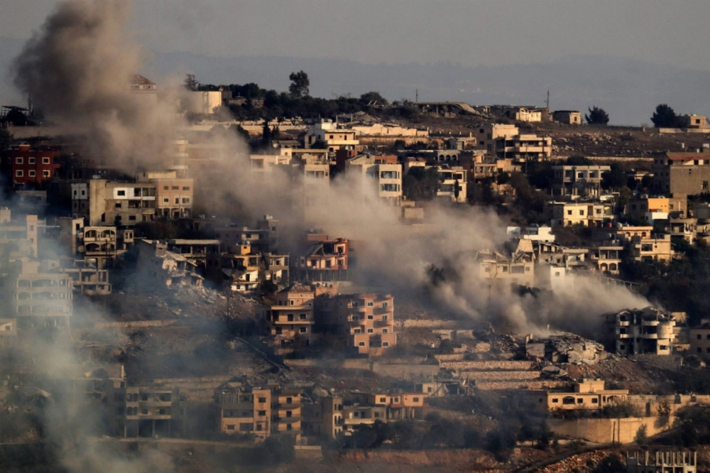 Smoke rises from the site of explosive detonations in the southern Lebanese village of Khiam on Thursday. Smoke rises from the site of explosive detonations in the southern Lebanese village of Khiam on Thursday.
