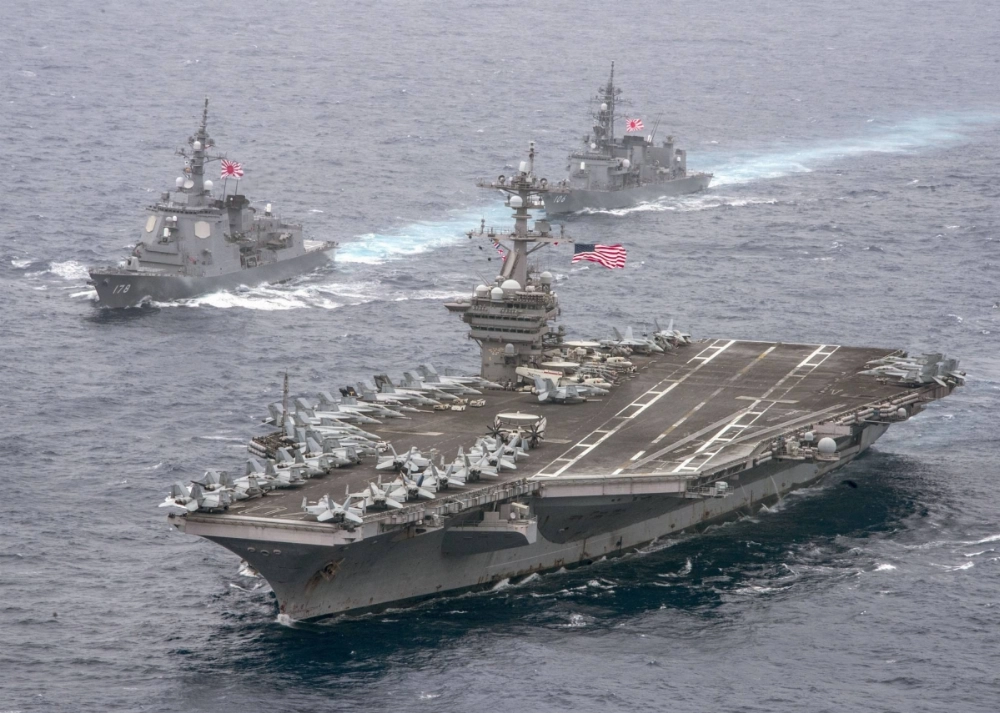 The U.S. aircraft carrier Carl Vinson and two Japanese Maritime Self-Defense Force destroyers transit the Philippine Sea in April 2017. Washington has recently deployed additional carrier strike groups to the Middle East as tensions in the region grow. The U.S. aircraft carrier Carl Vinson and two Japanese Maritime Self-Defense Force destroyers transit the Philippine Sea in April 2017. Washington has recently deployed additional carrier strike groups to the Middle East as tensions in the region grow.