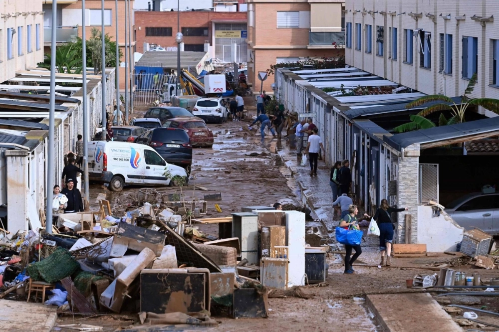 The devastating effects of flooding on a residential area in the town of Alfafar, in Spain's eastern Valencia region, on Friday. The devastating effects of flooding on a residential area in the town of Alfafar, in Spain's eastern Valencia region, on Friday.