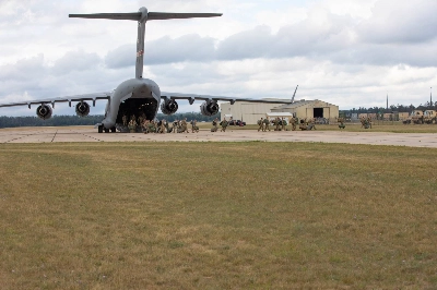 Tennessee National Guard soldiers offload from a C-17 aircraft at Grayling Army Airfield in Grayling, Michigan, in August 2022. Camp Grayling, which is within 160 kilometers (100 miles) of where China-linked electric vehicle battery maker Gotion plans to build a facility, will be added to an existing list where nearby property transactions may be reviewed by the Committee on Foreign Investment in the United States. Tennessee National Guard soldiers offload from a C-17 aircraft at Grayling Army Airfield in Grayling, Michigan, in August 2022. Camp Grayling, which is within 160 kilometers (100 miles) of where China-linked electric vehicle battery maker Gotion plans to build a facility, will be added to an existing list where nearby property transactions may be reviewed by the Committee on Foreign Investment in the United States.
