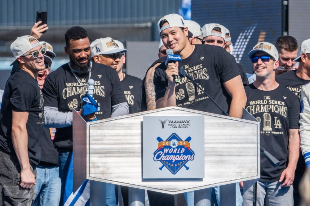 Shohei Ohtani speaks during the Dodgers' World Series celebration on Friday at Dodger Stadium in Los Angeles.  Shohei Ohtani speaks during the Dodgers' World Series celebration on Friday at Dodger Stadium in Los Angeles.