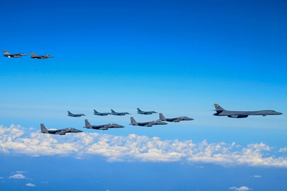 A U.S. Air Force B-1B bomber (front) flies in formation with South Korean, Japanese and U.S. fighter jets during a joint air drill in South Korean airspace south of Jeju Island on Sunday. 
  A U.S. Air Force B-1B bomber (front) flies in formation with South Korean, Japanese and U.S. fighter jets during a joint air drill in South Korean airspace south of Jeju Island on Sunday.