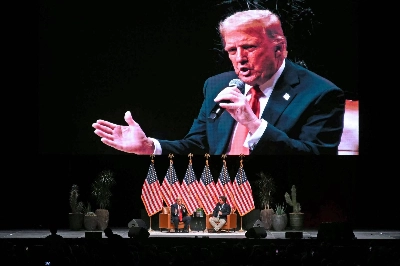Former U.S. President and Republican presidential candidate Donald Trump speaks during a live interview with U.S. commentator Tucker Carlson in the finale of the Tucker Carlson Live Tour at Desert Diamond Arena in Glendale, Arizona, on Thursday. Former U.S. President and Republican presidential candidate Donald Trump speaks during a live interview with U.S. commentator Tucker Carlson in the finale of the Tucker Carlson Live Tour at Desert Diamond Arena in Glendale, Arizona, on Thursday.