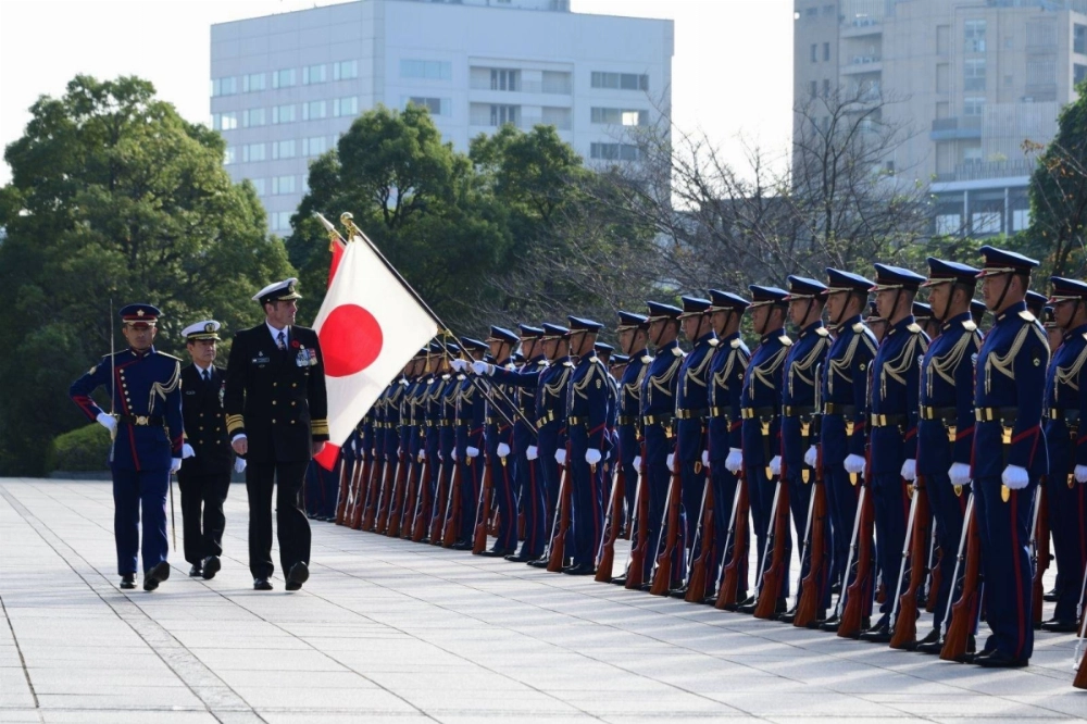 Royal Canadian Navy Commander Vice Adm. Angus Topshee inspects an honor guard with Maritime Self-Defense Force Chief of Staff Adm. Akira Saito during a meeting at the Defense Ministry in Tokyo on Friday. Royal Canadian Navy Commander Vice Adm. Angus Topshee inspects an honor guard with Maritime Self-Defense Force Chief of Staff Adm. Akira Saito during a meeting at the Defense Ministry in Tokyo on Friday.
