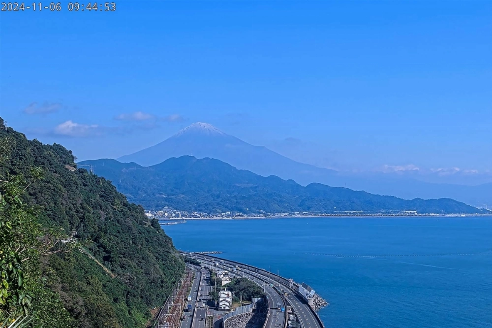 A screen grab taken from a live video stream broadcast by the Shizuoka Municipal Government on Wednesday shows Mount Fuji with a dusting of snow on its peak, seen from the Shizuoka side of the mountain.  A screen grab taken from a live video stream broadcast by the Shizuoka Municipal Government on Wednesday shows Mount Fuji with a dusting of snow on its peak, seen from the Shizuoka side of the mountain.