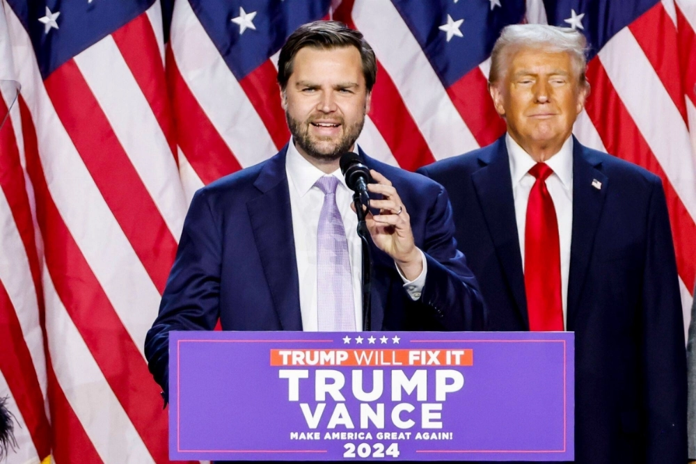 Republican Vice President-elect JD Vance (left) and President-elect Donald Trump speak during an election night event in West Palm Beach, Florida, on Wednesday. Republican Vice President-elect JD Vance (left) and President-elect Donald Trump speak during an election night event in West Palm Beach, Florida, on Wednesday.